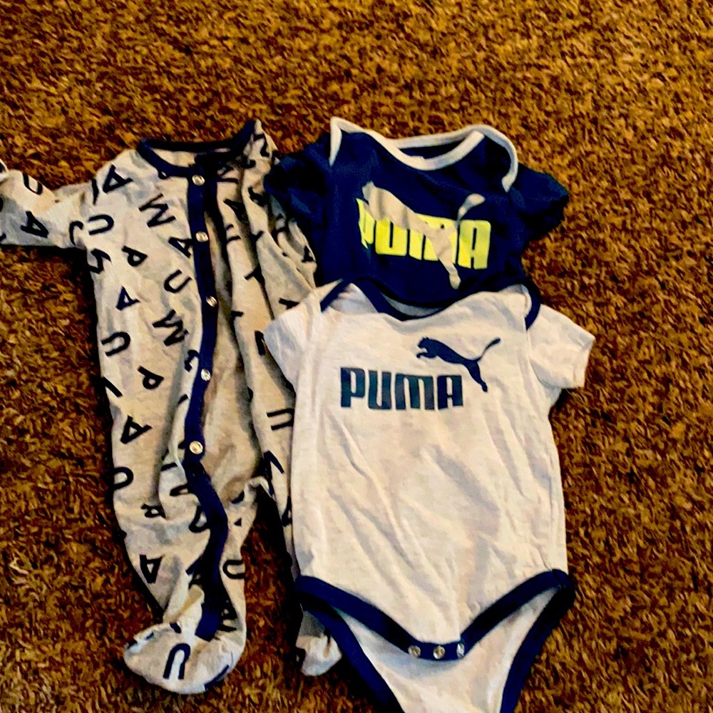 2 puma onesie and 1 puma pajamas